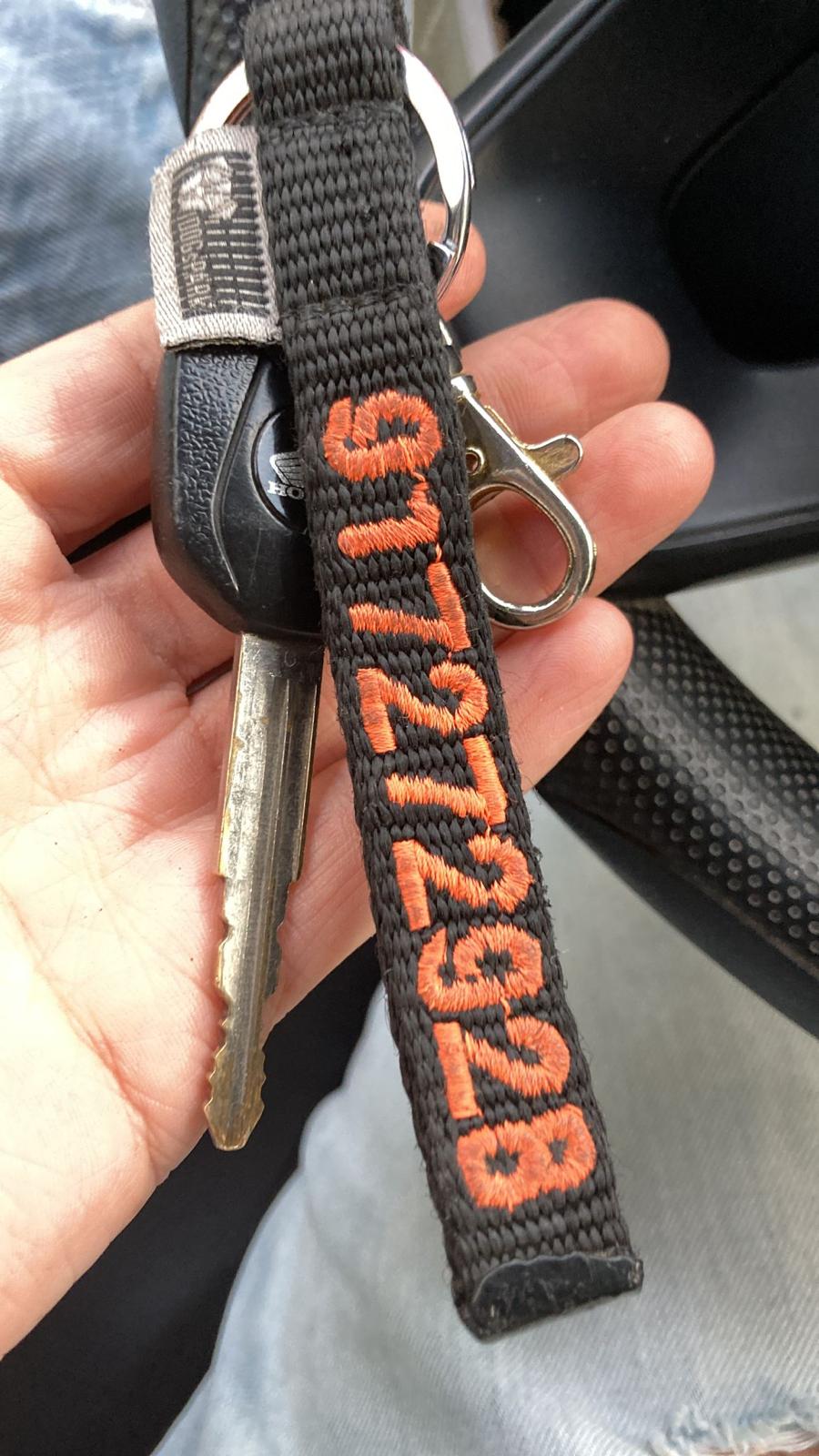 DOGsPARK Custom embroidered keychain black with orange embroidery text, 1,5cm wide. Handmade in Portugal